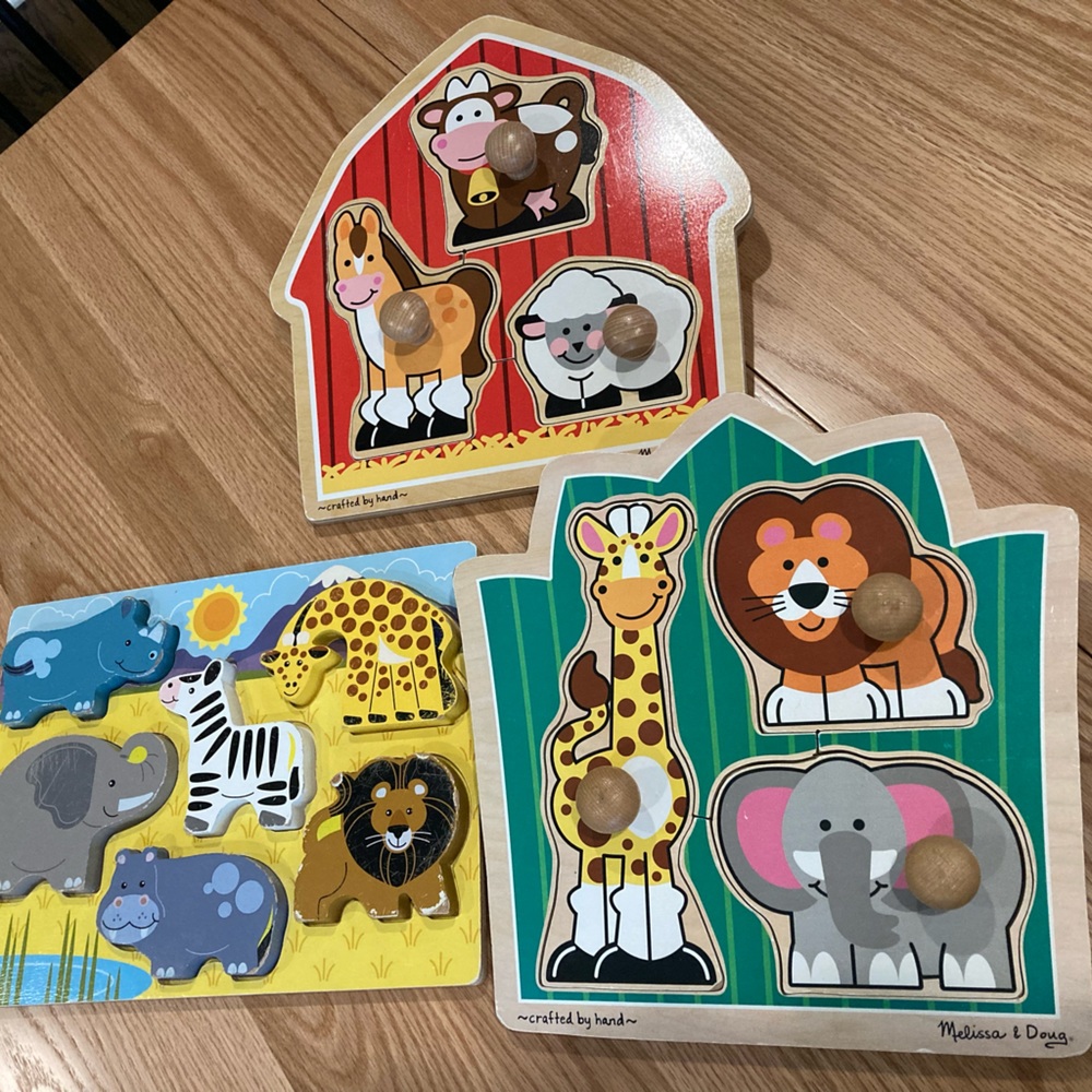 Lot of three wood toddler puzzles; two Melissa and Doug puzzles